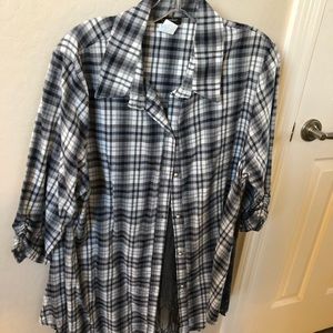 Button down shirt with a foot of lace on back